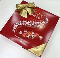 Конфеты LINDT LINDOR молочный MILK LAIT, красная подарочная с бантом плоская /картон/ 287г*12